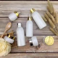 Wholesale High-grade golden carved ABS cap white glass cosmetic bottles/jars with good price
